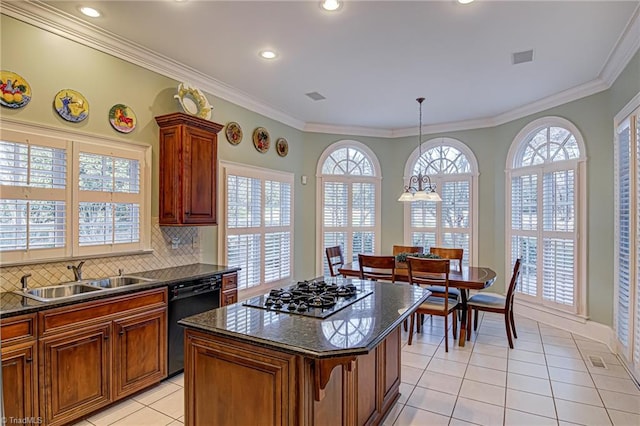 kitchen featuring tasteful backsplash, a kitchen island, stainless steel gas cooktop, black dishwasher, and sink