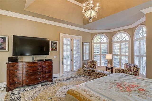 bedroom featuring access to exterior, crown molding, and a chandelier