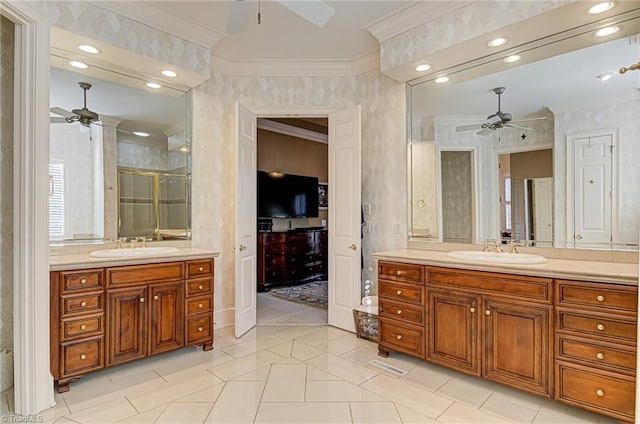 bathroom with double vanity, tile patterned flooring, ceiling fan, and ornamental molding