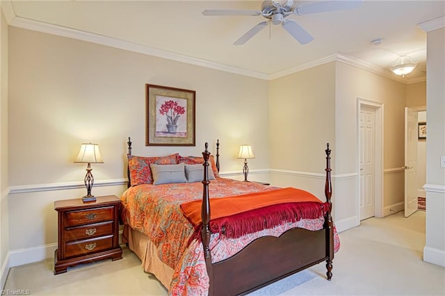 bedroom featuring ceiling fan, ornamental molding, and light colored carpet