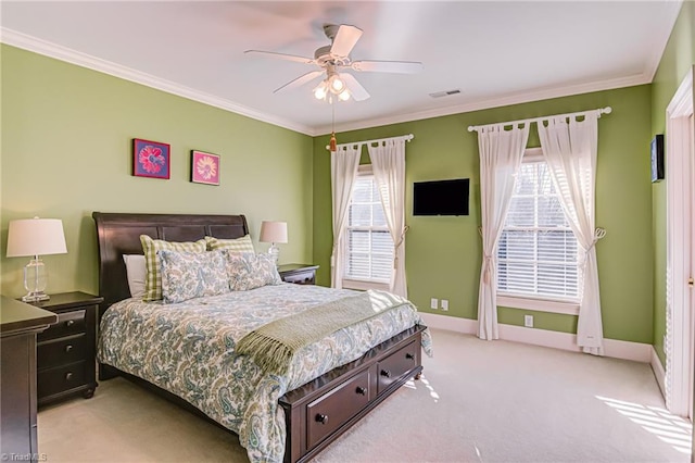 carpeted bedroom with multiple windows, crown molding, and ceiling fan