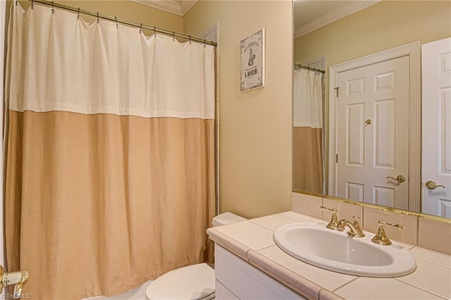 bathroom with toilet, vanity, walk in shower, and crown molding