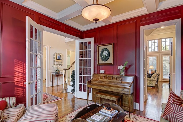 interior space featuring french doors, hardwood / wood-style floors, and coffered ceiling