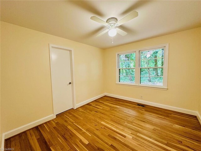 5670 Plantation Dr, Winston-Salem, NC 27105 - empty room featuring baseboards, ceiling fan, and wood finished floors