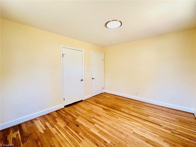 5670 Plantation Dr, Winston-Salem, NC 27105 - unfurnished room with baseboards and light wood-style floors