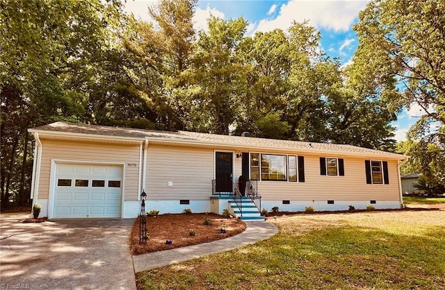 5670 Plantation Dr, Winston-Salem, NC 27105 - view of front of home with crawl space, an attached garage, a front yard, and driveway