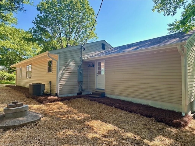 5670 Plantation Dr, Winston-Salem, NC 27105 - back of house featuring central air condition unit and entry steps