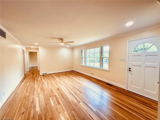 5670 Plantation Dr, Winston-Salem, NC 27105 - foyer with plenty of natural light, ornamental molding, light wood-style flooring, ceiling fan, and baseboards