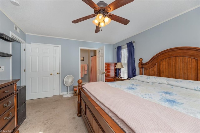 carpeted bedroom with crown molding, ceiling fan, and connected bathroom