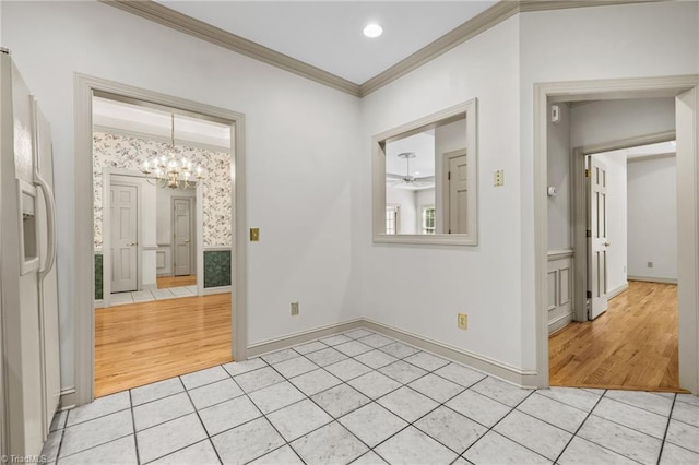 unfurnished bedroom with a notable chandelier, crown molding, white refrigerator with ice dispenser, and light hardwood / wood-style floors