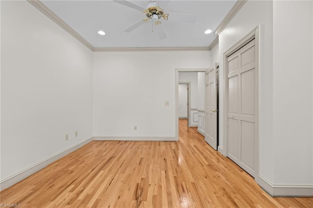 unfurnished bedroom featuring ceiling fan, ornamental molding, and light hardwood / wood-style flooring