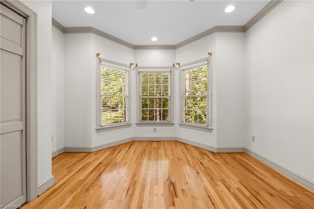 interior space featuring ornamental molding and light wood-type flooring