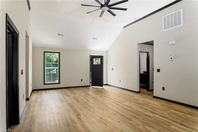6376 Welborn Rd, Trinity, NC 27370 - unfurnished living room with ceiling fan, lofted ceiling, and light wood-style floors