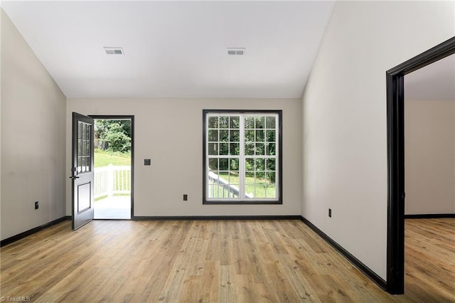 6376 Welborn Rd, Trinity, NC 27370 - unfurnished room with vaulted ceiling and light wood-style flooring