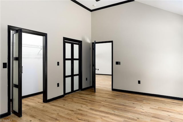 6376 Welborn Rd, Trinity, NC 27370 - spare room with light wood-type flooring, a high ceiling, and ornamental molding