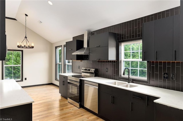 6376 Welborn Rd, Trinity, NC 27370 - kitchen with appliances with stainless steel finishes, dark cabinets, plenty of natural light, pendant lighting, and lofted ceiling