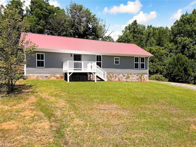 6376 Welborn Rd, Trinity, NC 27370 - view of front facade with a front lawn, a metal roof, a deck, and stairs