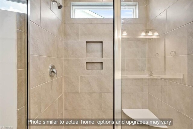 bathroom featuring a shower stall