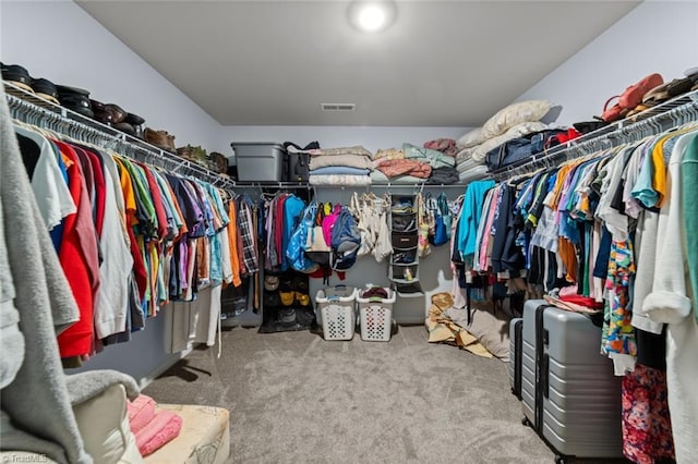 walk in closet with carpet floors and visible vents