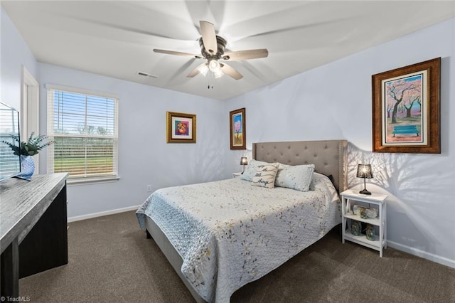 bedroom with dark colored carpet, a ceiling fan, visible vents, and baseboards