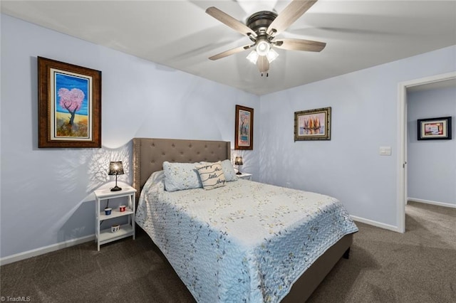 bedroom featuring baseboards, dark colored carpet, and a ceiling fan