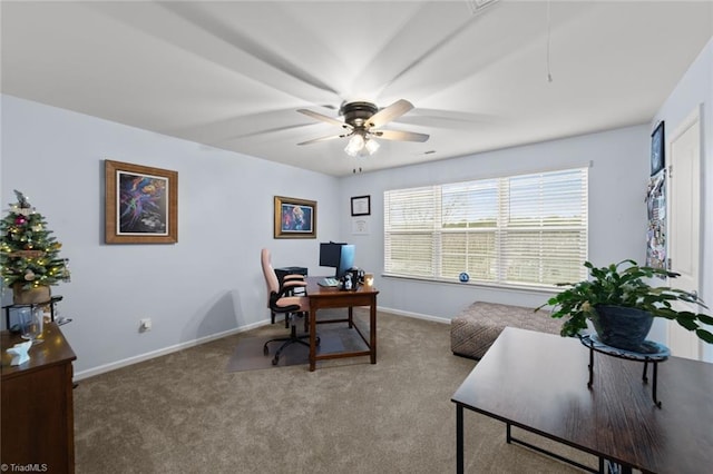 carpeted home office with a ceiling fan, attic access, and baseboards