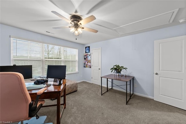 office with carpet floors, attic access, baseboards, and ceiling fan