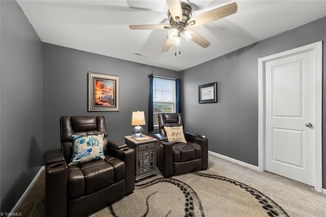 interior space featuring a ceiling fan, carpet flooring, visible vents, and baseboards