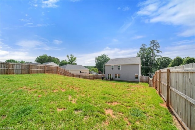 view of yard featuring a fenced backyard