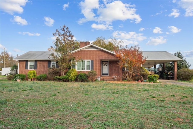 ranch-style home with a carport and a front lawn