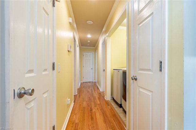 3289 Tobaccoville Rd, Tobaccoville, NC 27050 - corridor featuring light wood-style flooring, crown molding, baseboards, and washer / dryer
