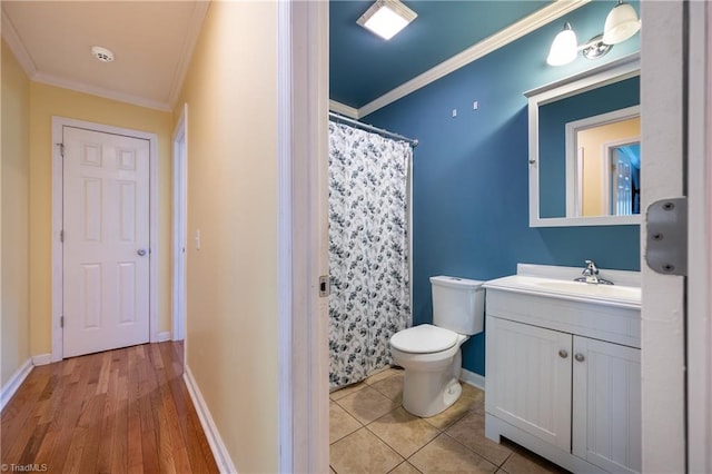 3289 Tobaccoville Rd, Tobaccoville, NC 27050 - bathroom with vanity, baseboards, ornamental molding, and toilet