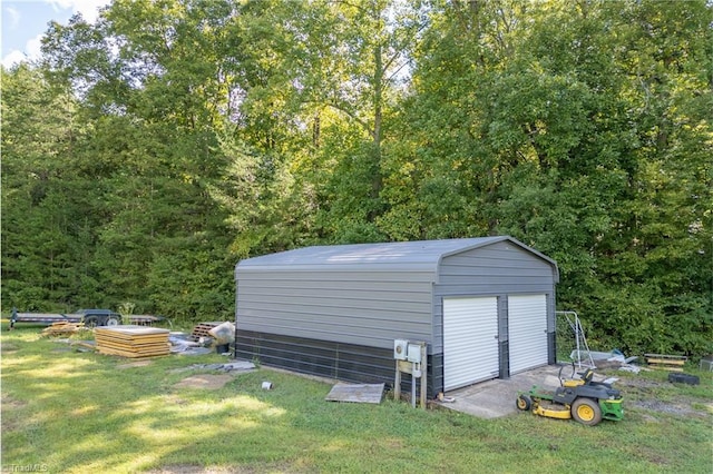 3289 Tobaccoville Rd, Tobaccoville, NC 27050 - garage featuring a shed and a view of trees