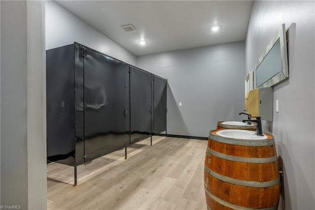 3289 Tobaccoville Rd, Tobaccoville, NC 27050 - bathroom featuring recessed lighting, double vanity, and wood finished floors