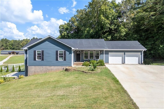 3289 Tobaccoville Rd, Tobaccoville, NC 27050 - view of front facade featuring driveway, fence, a garage, and a front lawn