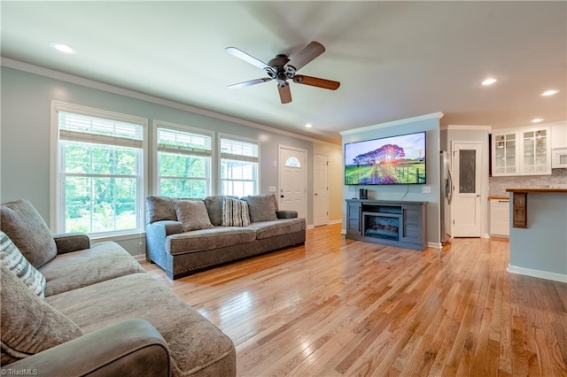 3289 Tobaccoville Rd, Tobaccoville, NC 27050 - living room with recessed lighting, a fireplace, crown molding, and ceiling fan