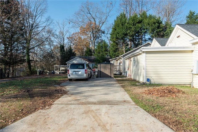 view of side of property featuring a storage unit