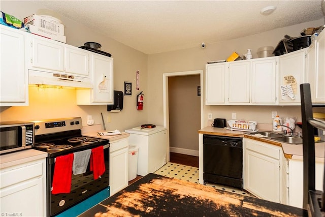 kitchen with white cabinets, appliances with stainless steel finishes, a textured ceiling, and sink