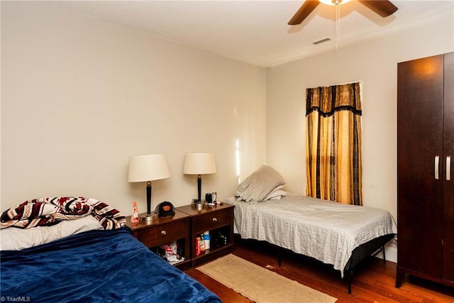 bedroom featuring wood-type flooring and ceiling fan