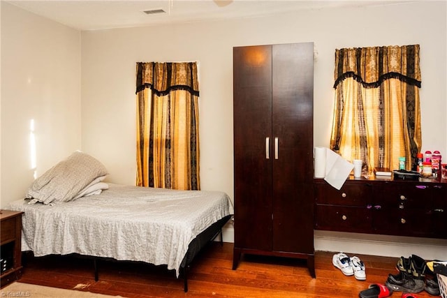 bedroom featuring ceiling fan and wood-type flooring