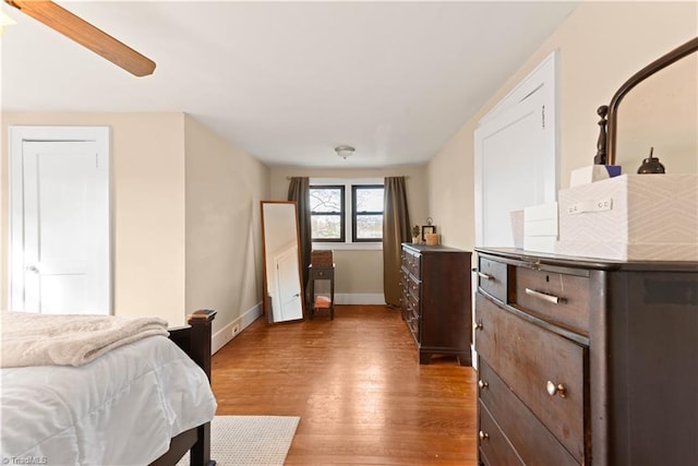 bedroom featuring wood-type flooring and ceiling fan