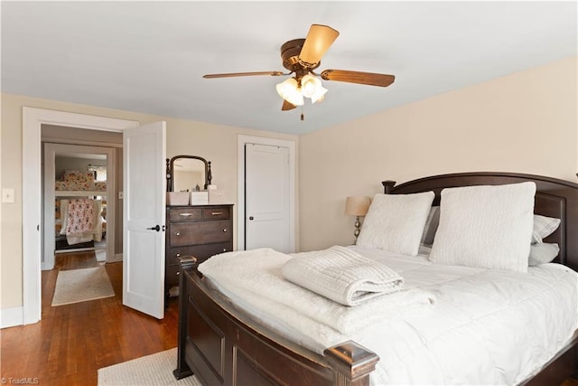 bedroom with ceiling fan and dark wood-type flooring