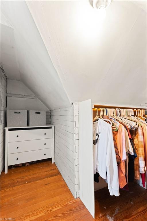 interior space with light hardwood / wood-style flooring and lofted ceiling