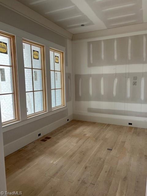 7920 Valley View Dr, Clemmons, NC 27012 - unfurnished room with light wood-style flooring, baseboards, and healthy amount of natural light