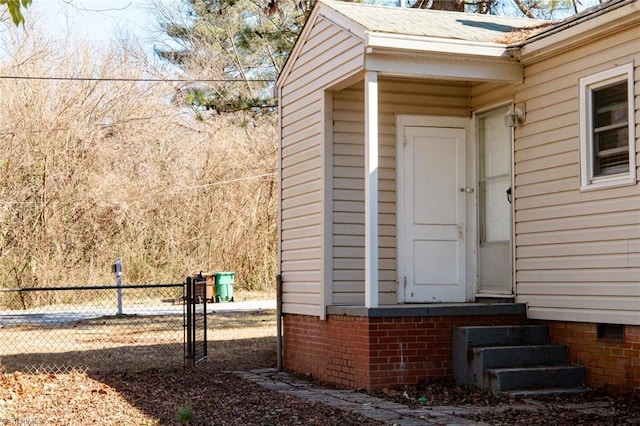 property entrance featuring fence