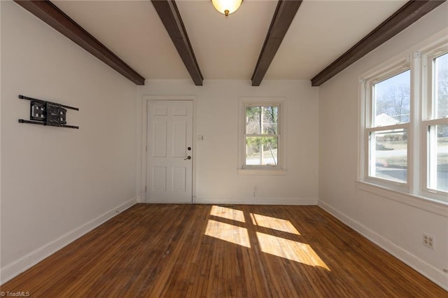 interior space with dark wood-style floors, beam ceiling, and baseboards