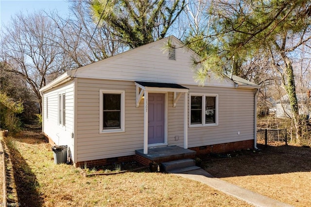 bungalow-style house featuring crawl space and fence