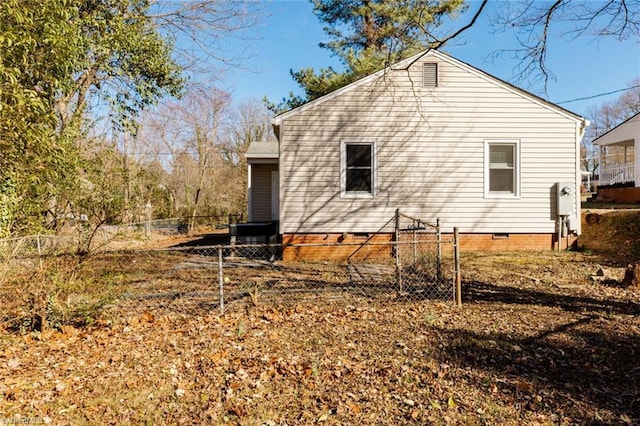 view of property exterior featuring crawl space and fence