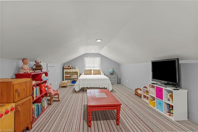 bedroom featuring lofted ceiling and carpet flooring