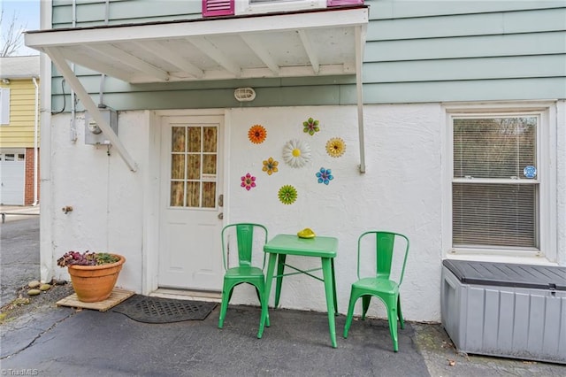 doorway to property featuring a patio area